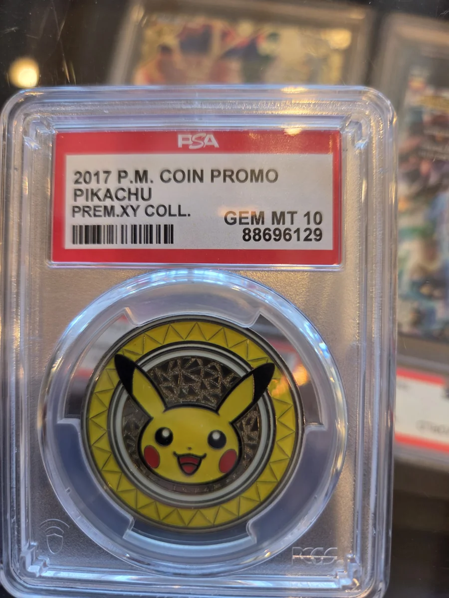 PSA 10 Gem Mint 2017 Pikachu coin promo from the Premium XY Collection in a PSA slab